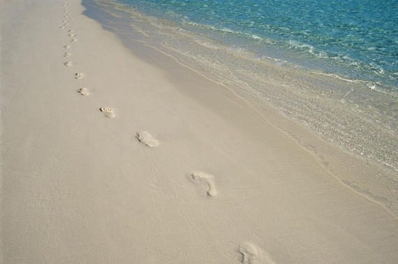 Footprints on a beach, imagesource.com