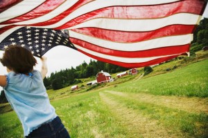 Girl running with American flag