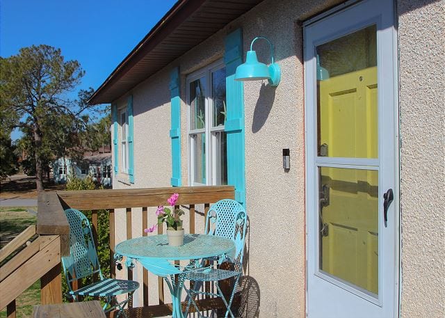 The yellow Tybee Island door at Coastal Joy Cottage