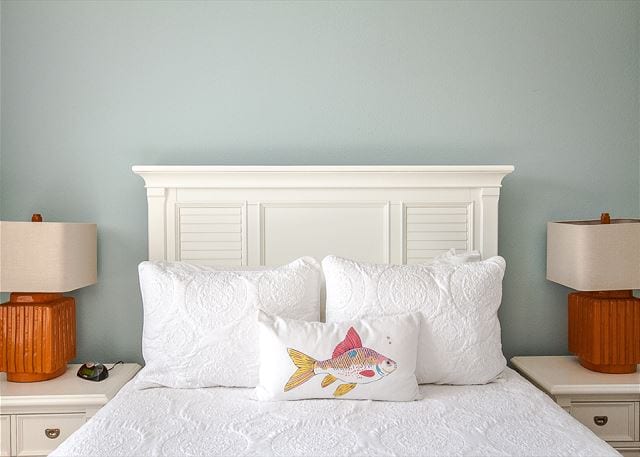 pillows on a bed at 1th street dream cottage
