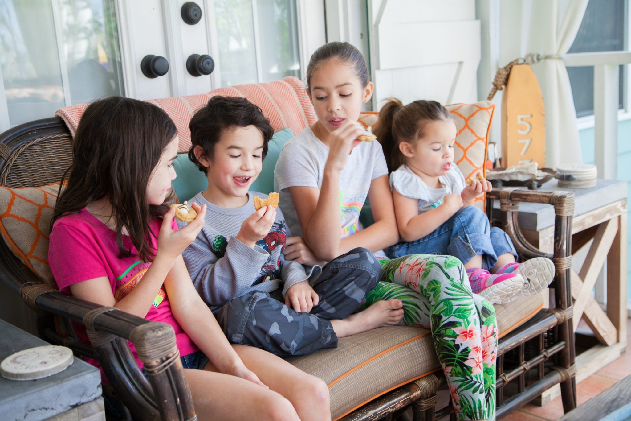 children enjoying the porch at tybee tides cottage