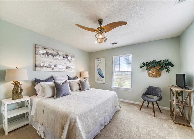 the master bedroom at marsh mermaid vacation rental