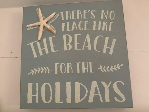 holiday sign at tybee tides cottage