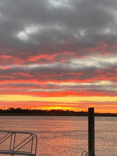 the midwest mermaid back river sunset
