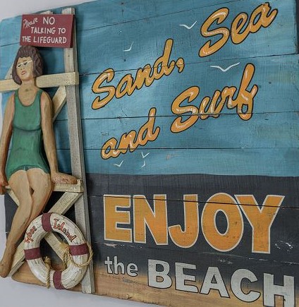 woodie's place beach sign
